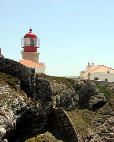 The red-topped lighthouse of Cabo de São Vicente above the rocks